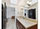 Stylish bathroom featuring granite counters, neutral color palette, and ample lighting at 7109 Pelican Island Dr, Tampa, FL 33634