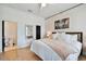 Bedroom featuring hardwood floors and patterned wallpaper at 7109 Pelican Island Dr, Tampa, FL 33634