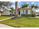 Charming one-story home featuring a well-manicured lawn and elegant entrance, ideal for a serene lifestyle at 7109 Pelican Island Dr, Tampa, FL 33634