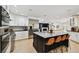 Bright open kitchen features a large island, stainless appliances, and modern finishes for a chef-inspired space at 7109 Pelican Island Dr, Tampa, FL 33634