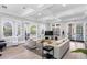 Open and airy clubhouse with stylish seating, coffered ceilings, and an abundance of natural light at 716 Promenade Pl, Tampa, FL 33602