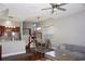Bright dining area features hardwood floors, modern lighting, and a comfortable setting at 716 Promenade Pl, Tampa, FL 33602