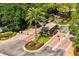 Gated community entrance featuring lush landscaping and a secure entry point at 716 Promenade Pl, Tampa, FL 33602