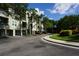 Well-maintained condo building with garages and lush landscaping at 716 Promenade Pl, Tampa, FL 33602