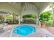 Cozy hot tub with covered gazebo and landscaped surroundings at 716 Promenade Pl, Tampa, FL 33602