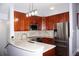 Modern kitchen features stainless steel appliances, granite countertops, and ample cabinetry at 716 Promenade Pl, Tampa, FL 33602