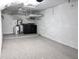 Spacious laundry room with epoxy floors and modern washer and dryer at 716 Promenade Pl, Tampa, FL 33602