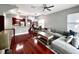 Open-concept living space with hardwood floors, modern furniture, and natural light at 716 Promenade Pl, Tampa, FL 33602