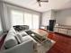 Cozy living room filled with natural light, features a plush sofa and stylish decor at 716 Promenade Pl, Tampa, FL 33602