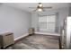 Bright bedroom with hardwood floors, large window, and window shade at 716 Promenade Pl, Tampa, FL 33602