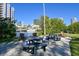 Picturesque waterfront picnic area with tables, benches, and lush greenery at 716 Promenade Pl, Tampa, FL 33602
