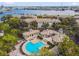 Stunning aerial view of condos with a resort-style pool and beautifully landscaped grounds at 716 Promenade Pl, Tampa, FL 33602