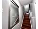 Modern stairway featuring hardwood steps and a sleek, contemporary design at 716 Promenade Pl, Tampa, FL 33602