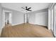 Spacious bedroom with ceiling fan, walk-in closet, and adjoining bathroom at 8504 N 17Th St, Tampa, FL 33604