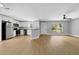 Updated kitchen and dining space with stainless appliances, white cabinets, and wood floors at 8504 N 17Th St, Tampa, FL 33604