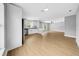Bright living room and kitchen area with modern appliances and light wood flooring at 8504 N 17Th St, Tampa, FL 33604