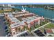 An aerial view of the condo with serene water views, nearby parking and exterior balconies at 8931 Blind Pass Rd # 360, St Pete Beach, FL 33706