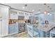 Bright kitchen featuring stainless steel appliances, modern cabinets, and a spacious island at 8931 Blind Pass Rd # 360, St Pete Beach, FL 33706