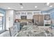 Bright kitchen featuring stainless steel appliances, modern cabinets, and a spacious island at 8931 Blind Pass Rd # 360, St Pete Beach, FL 33706
