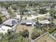 Aerial view of a home with a large backyard, mature trees, and surrounding residential neighborhood at 9240 53Rd N Way, Pinellas Park, FL 33782