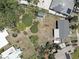 Aerial view of the property showcasing the backyard, shed, garden, and surrounding neighborhood at 9240 53Rd N Way, Pinellas Park, FL 33782