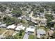 Neighborhood aerial view showcasing well-maintained lawns, diverse home styles, and mature trees at 9240 53Rd N Way, Pinellas Park, FL 33782