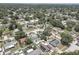 Scenic aerial view of a residential area with tidy streets, various rooftops, and lush greenery at 9240 53Rd N Way, Pinellas Park, FL 33782