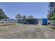 Backyard featuring a covered patio, garden, utility trailer and ample space for outdoor activities at 9240 53Rd N Way, Pinellas Park, FL 33782