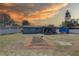 Spacious backyard with a covered patio, new garden and a utility trailer, perfect for outdoor enjoyment at 9240 53Rd N Way, Pinellas Park, FL 33782