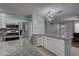 Modern kitchen with stainless steel appliances, granite countertops, and a stylish chandelier at 9240 53Rd N Way, Pinellas Park, FL 33782
