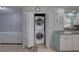 Convenient laundry area features a stacked washer and dryer, adding functionality to the kitchen space at 9240 53Rd N Way, Pinellas Park, FL 33782