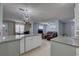 Open living area with seamless flow from the kitchen to the living room and dining space at 9240 53Rd N Way, Pinellas Park, FL 33782