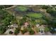 Beautiful aerial view of a lot next to a pond, surrounded by mature trees at 10040 Lake Dr, Weeki Wachee, FL 34613