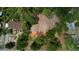 Aerial view of the cleared land surrounded by lush trees near a residential house at 10040 Lake Dr, Weeki Wachee, FL 34613