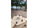 Backyard fire pit area with seating and scenic pond views at 10040 Lake Dr, Weeki Wachee, FL 34613