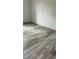 Bedroom features sleek, modern flooring and neutral wall color at 10040 Lake Dr, Weeki Wachee, FL 34613