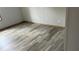 Bedroom features sleek, modern flooring and neutral wall color at 10040 Lake Dr, Weeki Wachee, FL 34613