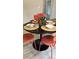 A dining room table is adorned with decorative plates and centerpieces at 10040 Lake Dr, Weeki Wachee, FL 34613