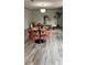Dining room featuring a round table set for four, modern chairs, and stylish decor at 10040 Lake Dr, Weeki Wachee, FL 34613