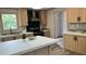 Well-equipped kitchen features sleek appliances, a center island and plenty of storage space at 10040 Lake Dr, Weeki Wachee, FL 34613