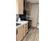 Well-equipped kitchen featuring stainless steel appliances and functional wood cabinets at 10040 Lake Dr, Weeki Wachee, FL 34613