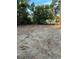 Cleared waterfront property lot featuring trees and a peaceful lake view in the background at 10040 Lake Dr, Weeki Wachee, FL 34613