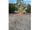 Cleared waterfront property lot featuring trees and a peaceful lake view in the background at 10040 Lake Dr, Weeki Wachee, FL 34613