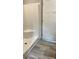 An accessible tiled shower with a corner seat at 10040 Lake Dr, Weeki Wachee, FL 34613