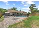 Private fenced-in backyard features a pool, brick patio, and plenty of room for entertaining at 10310 Salisbury St, Riverview, FL 33569