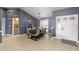 Elegant dining area with stylish lighting, seating for six, and easy access to the kitchen at 10310 Salisbury St, Riverview, FL 33569