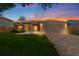 Charming single-story home featuring a well-manicured lawn and brick-paved driveway, complemented by a two-car garage at 10310 Salisbury St, Riverview, FL 33569