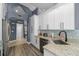 Well-lit kitchen with stainless steel appliances, granite counters, and tiled backsplash at 10310 Salisbury St, Riverview, FL 33569
