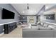 Spacious living room with tile flooring, vaulted ceilings, and a cozy fireplace for Gathering gatherings at 10310 Salisbury St, Riverview, FL 33569
