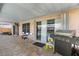 Spacious covered patio with BBQ grill, perfect for outdoor dining at 10310 Salisbury St, Riverview, FL 33569